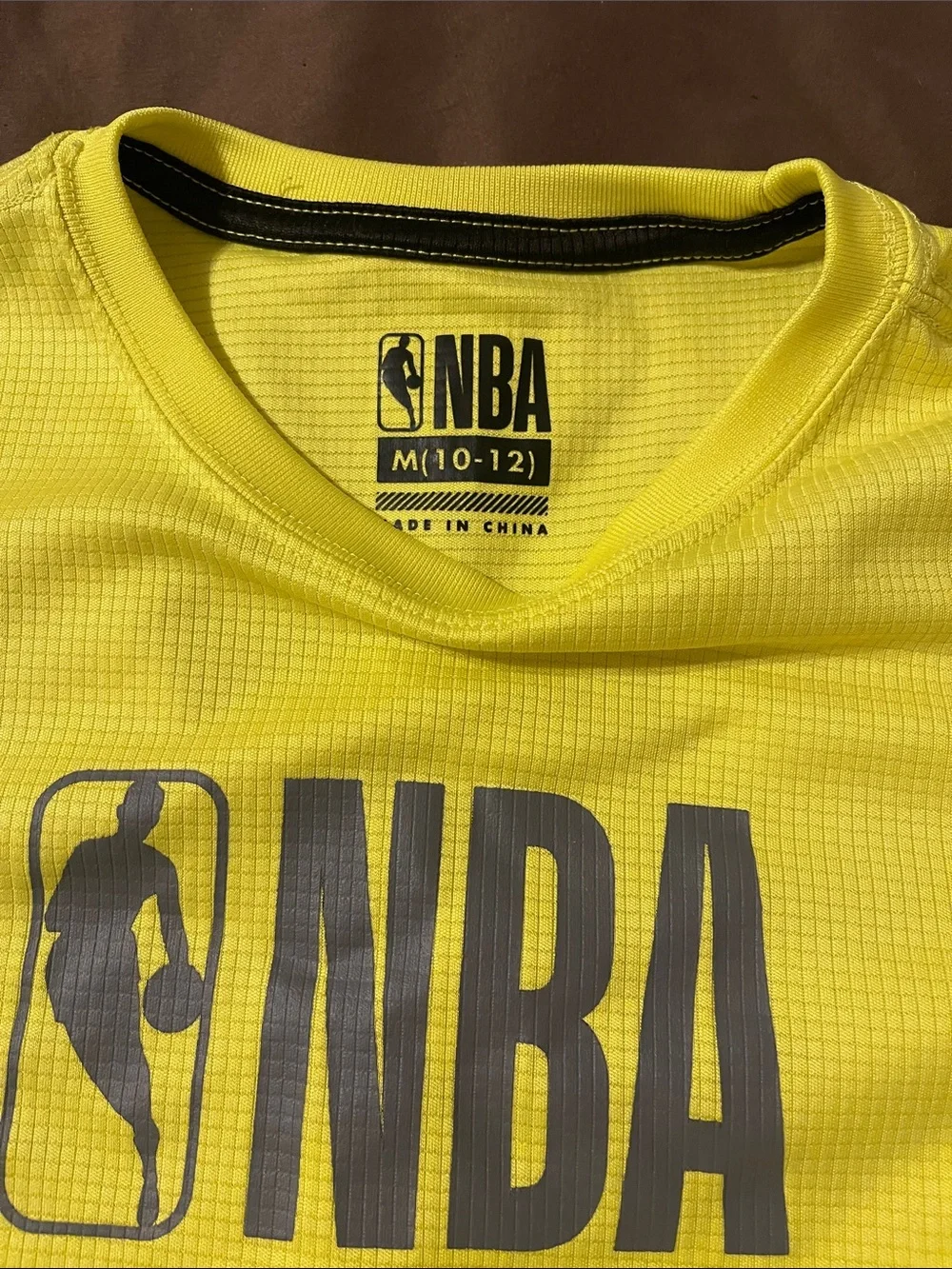 NBA Short sleeve yellow sleek shirt, size medium, NBA black joggers size small.